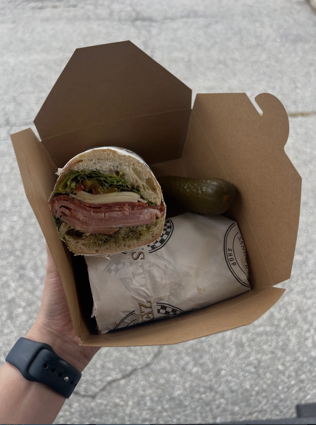 The Italian Stallion with layers of Italian meats, mozzarella, and arugula on fresh bread
